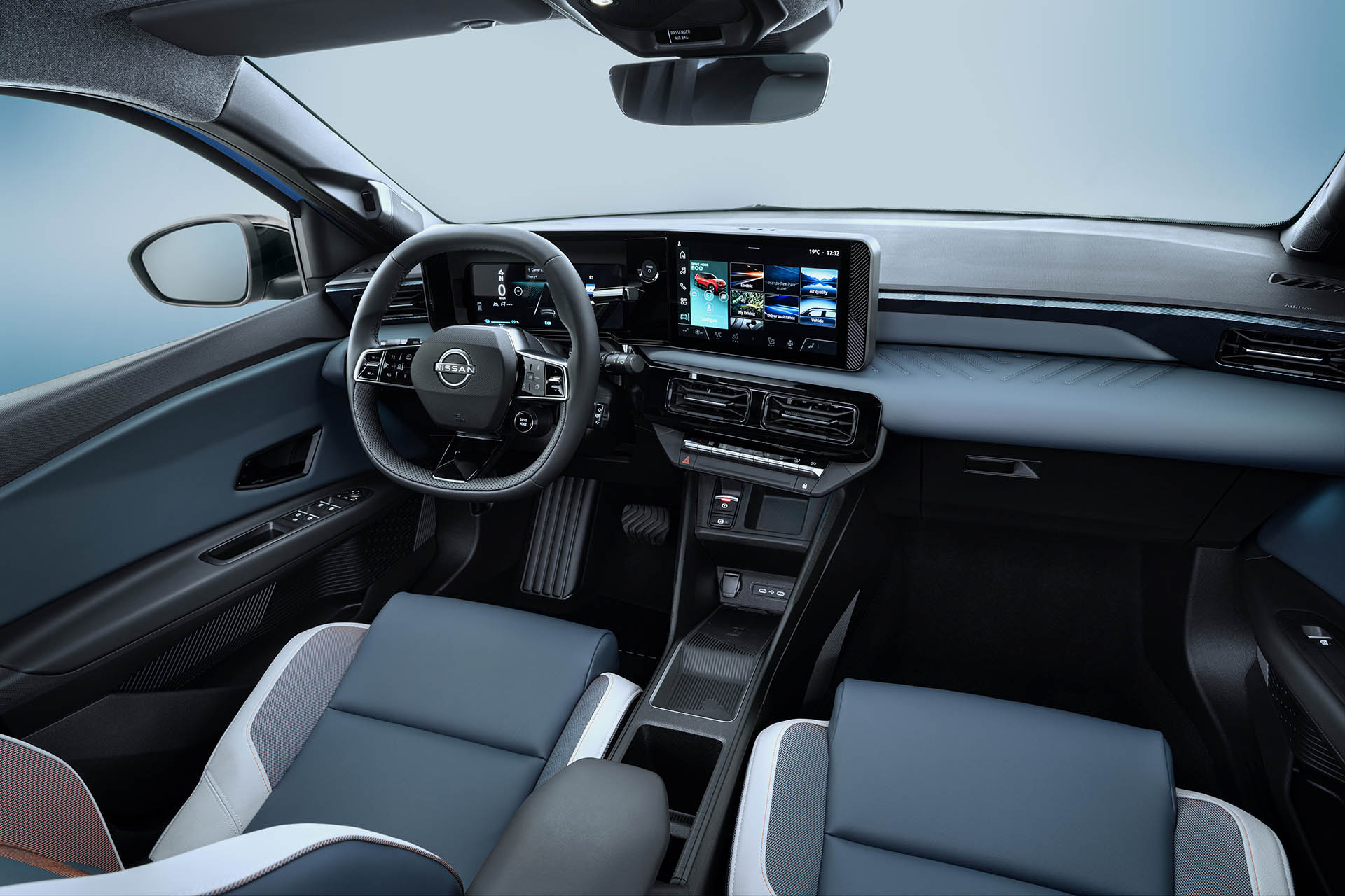 Passenger-pov-of-full-dashboard-cockpit-showing-steering-wheel-driver-focused-infotainment-showing-ECO-drive-mode-rear-view-mirror-front-seats-and-side-mirrors